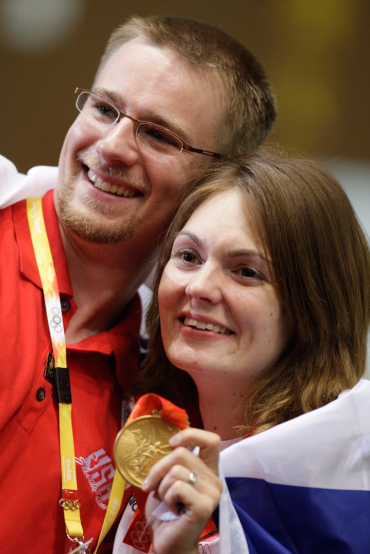 Katerina Emmons of the Czech Republic celebrates with her husband, U.S. shooter Matt Emmons, after winning the gold medal in the women's 10m air rifle shooting competition at the Beijing 2008 Olympic Games