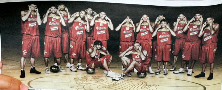 Spain's Olympic basketball team makes slant-eyed gestures while posing for an Olympics publicity photo.