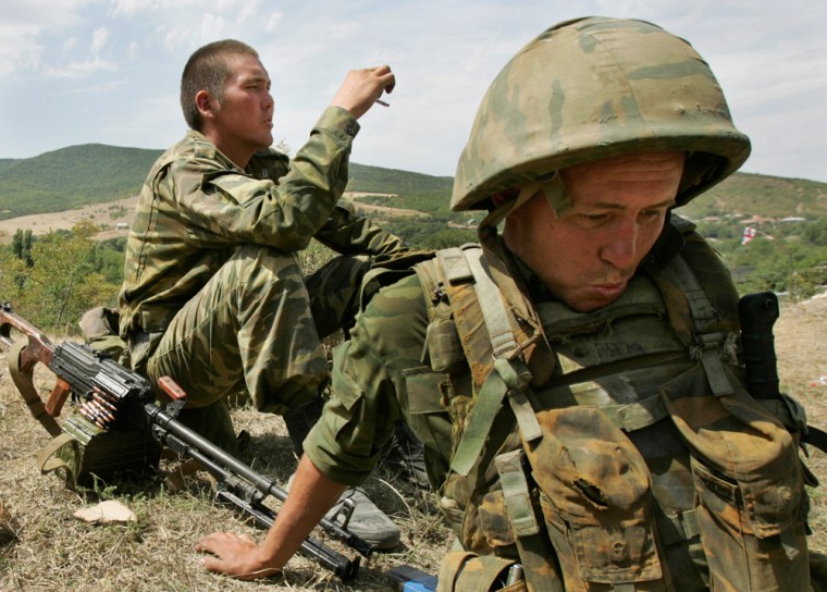 Image: Russian troops rest after digging trenches