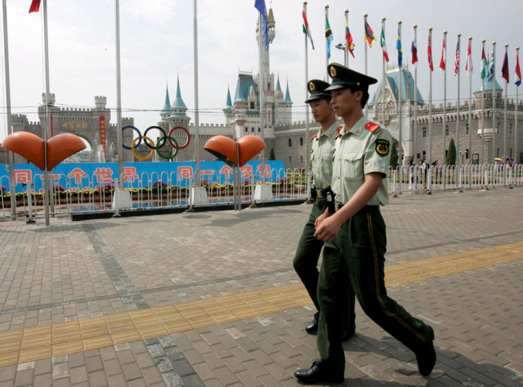 Image: Paramilitary police walk past World Park