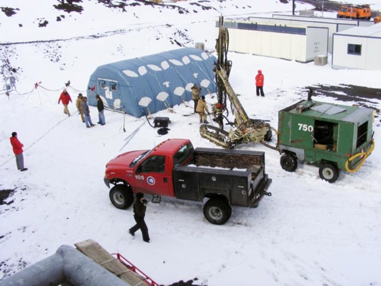An inflatable moon base prototype (blue structure at upper right) is tested at the McMurdo station in Antarctica as part of a joint program by NASA, the NSF and the firm ILC Dover. Credit: NASA.