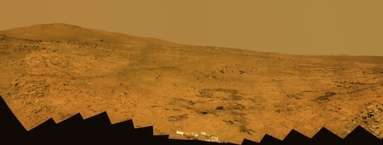 While NASA's Opportunity rover is climbing out of Mars' Victoria Crater, the Spirit rover is spending its third Martian winter on the other side of the planet inside Gusev Crater. This 180-degree panorama shows the southward vista from Spirit's winter home.