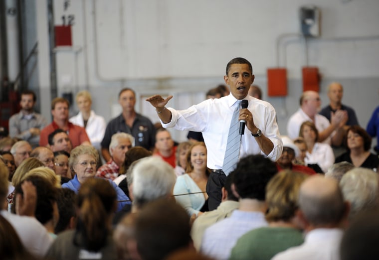Image: Barack Obama speaks during a townhall meeting at the Kansas City international airport
