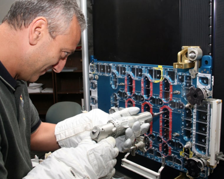 Image: Mike Massimino practices EVA procedures