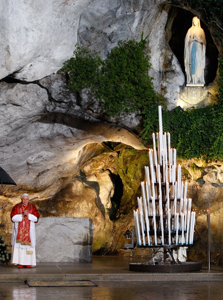 Image: Pope Benedict XVI prays inside the Grotto of the Apparitions in Lourdes