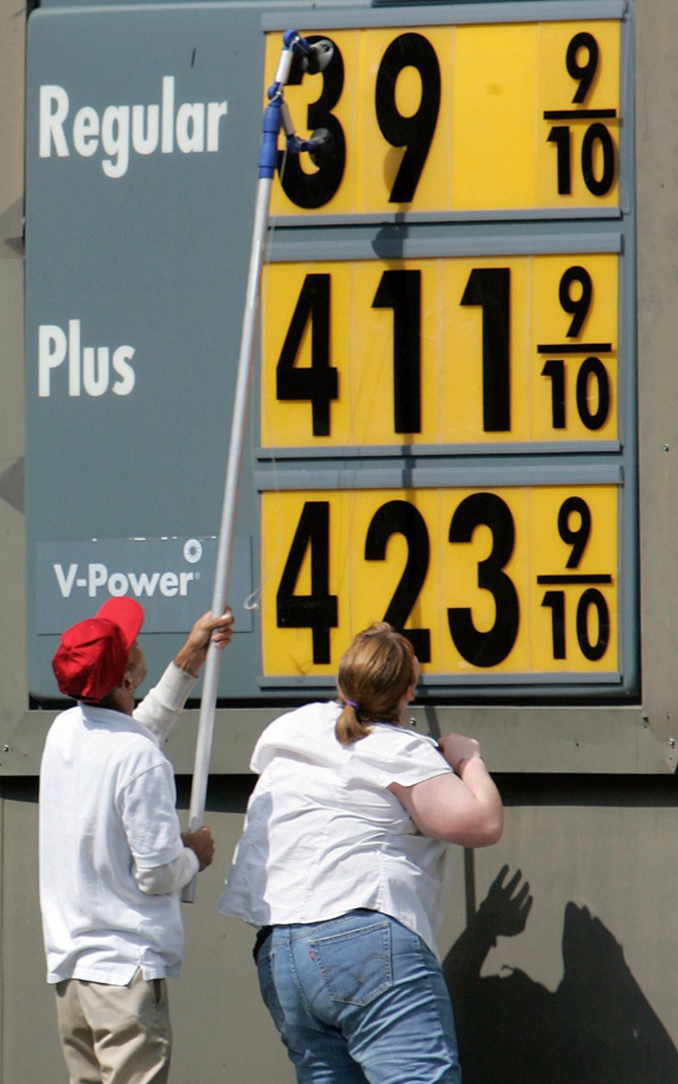 Image: Little Rock, Ark., gas station employees change the price sign for fuel Friday, Sept. 12, 2008.