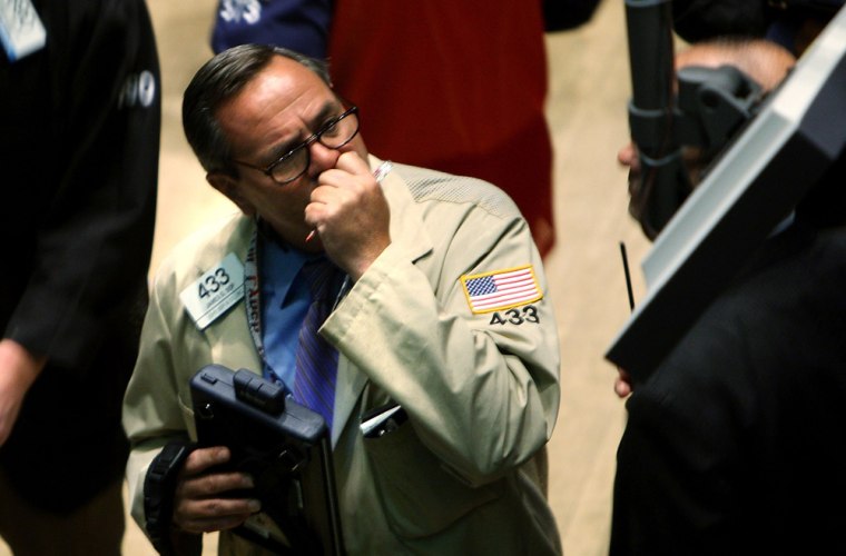 Image:  A trader works on the floor of the New York Stock Exchange