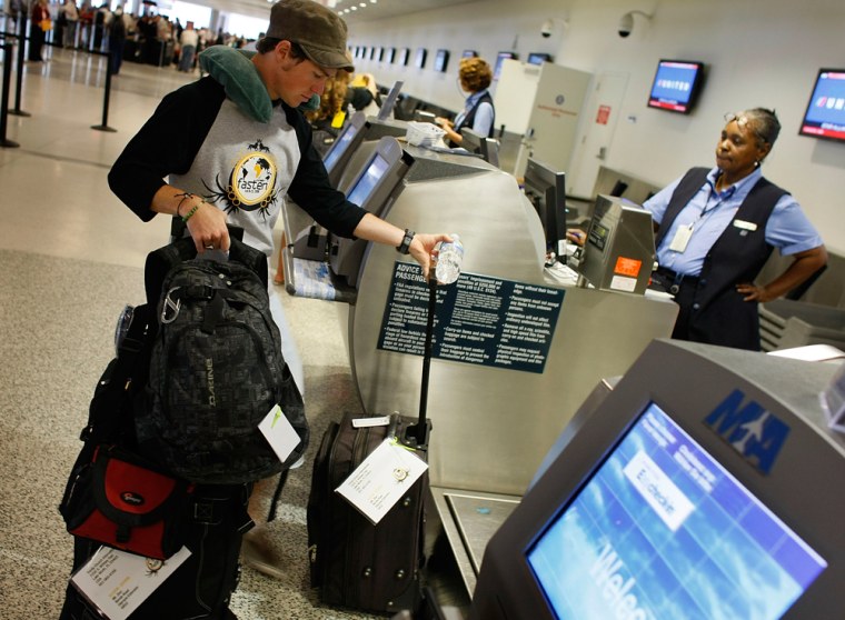 IMage: A passenger checks his bags