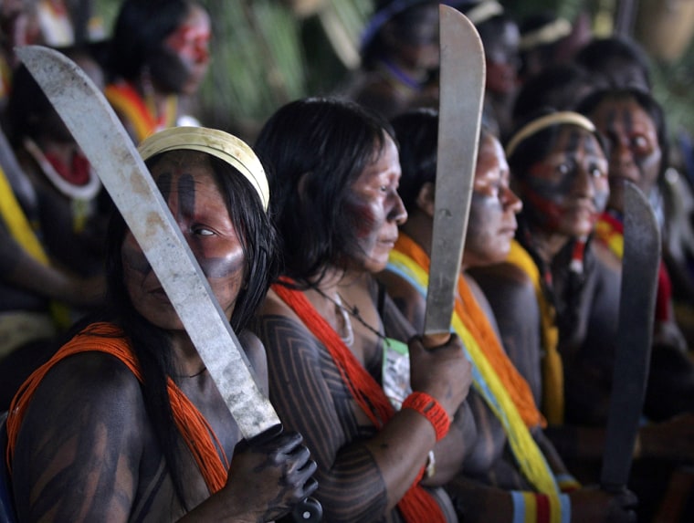 Image: Indigenous women, bearing machetes, protests against the construction of the Belo Monte hydropower dam