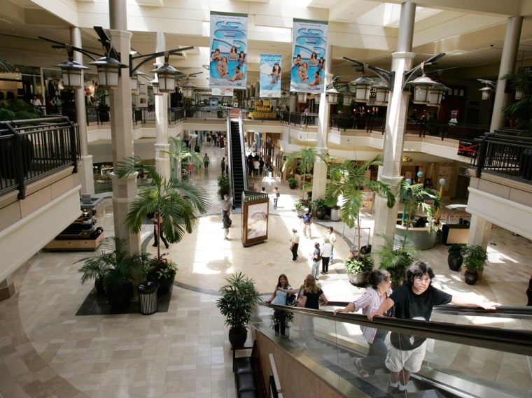 Image: Shoppers walk inside a large mall