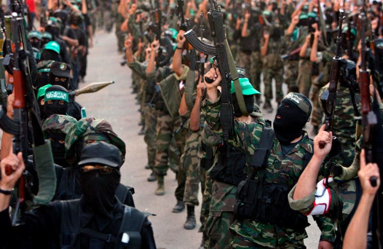Image: Palestinian Hamas militants take part in a rally
