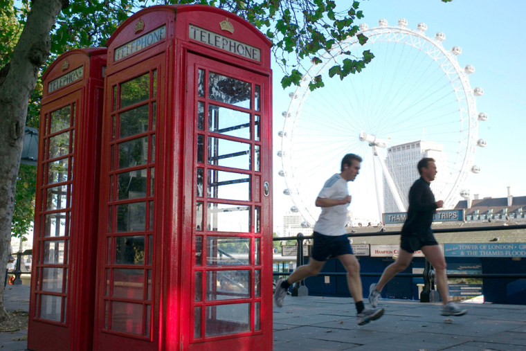 Image: Two telephone boxes are is seen on the River Thames Embankment