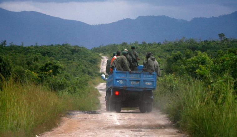 Rebels loyal to Laurent Nkunda's rebel movement are seen traveling through the Virunga National Park on their way to Tongo, some 100 kilometers (62 miles) north of Goma, eastern Congo, Sunday, Nov. 2, 2008. Tutsi-led rebels tightened their hold on newly seized swaths of eastern Congo Saturday, forcing tens of thousands of frightened, rain-soaked civilians out of makeshift refugee camps and stopping some from fleeing to government-held territory. (AP Photo/Jerome Delay)
