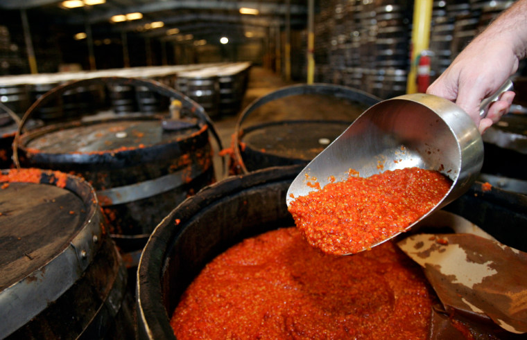 Ground Tabasco peppers are shown in wooden casks as they age. The factory makes 600,000 bottles of the special sauce a day at Avery Island, La. There's another tourist draw in addition to the Tabasco factory — a 250-acre wildlife refuge called Jungle Gardens that is also part of the McIlhenny family legacy.