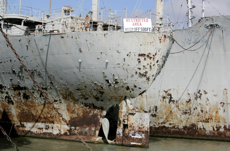 A pair of aging and rusting World War II Victory ships are anchored side by side at the Suisun Bay Reserve Fleet in Suisun Bay, Calif., Friday, June 29, 2007. From a busy bridge in the suburbs east of San Francisco, commuters catch a daily glimpse of one of the country's stranger graveyards. Moored in ghostly ranks in the brackish water below, the Suisun Bay Reserve Fleet looks from a distance like a fierce phalanx ready for battle _ a proud reminder of the San Francisco Bay area's naval heritage. (AP Photo/Eric Risberg)