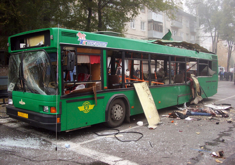 A bus damaged by an explosion is seen on a street in the city of Togliatti
