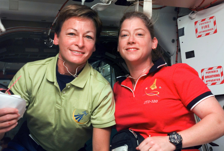 Peggy A. Whitson, left, is the international space station's first female skipper and Pamela Melroy is the space shuttle Discovery commander. The joint mission marks the first time both spacecraft have been commanded by females simultaneously. 