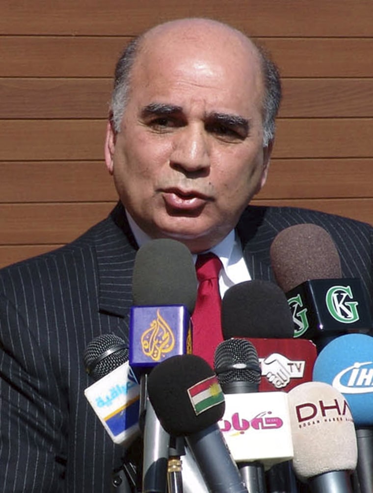 Fouad Hussain speaks during a news conference in Arbil