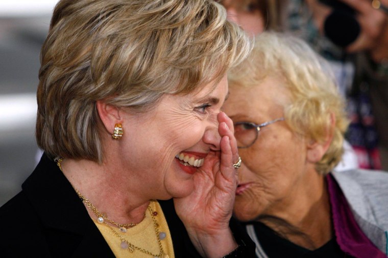 Democratic presidential candidate Senator Hillary Clinton (D-NY) shares a laugh with supporter Pam Espinoza in Oskaloosa