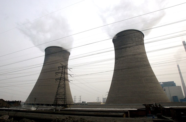 **ADVANCE FOR MONDAY, NOV. 5** A smoking power plant is seen, March 20, 2007 in Taiyuan, Shanxi Province, China. (AP Photo/Eugene Hoshiko)