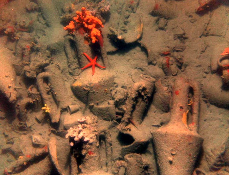 Ceramic jars onboard a 2,400-year-old shipwreck, with starfish and sponges growing on them. DNA analysis shows these jars held olive oil flavored with oregano and possibly wine. Credit: Woods Hole Oceanographic Institution, Hellenic Ministry of Culture Ephorate of Underwater Antiquities, Hellenic Centre for Marine Research.