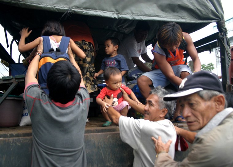 Image: Children evacuate in advance of the storm