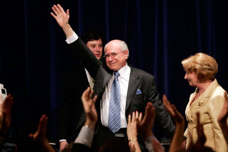 Image: Australian Prime Minister John Howard waves to his supporters after conceding defeat at a hotel in Sydney.
