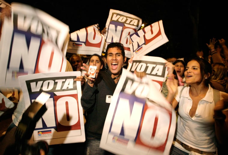 Image: Supporters of an opposition group celebrate after winning in Caracas