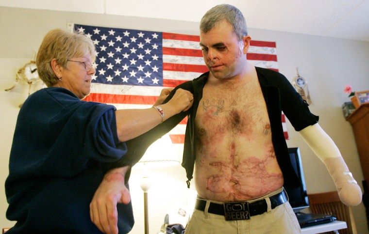 Image: Michael Lage is assisted by his mother Rose Lage