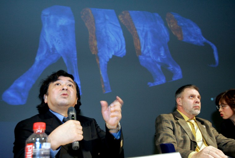 Naoki Suzuki, left, professor at Japan's Jikei University, explains about the 3-D images of frozen carcass of a 37,000-year-old baby mammoth at a press conference in Tokyo on Friday, Jan. 4, 2008.