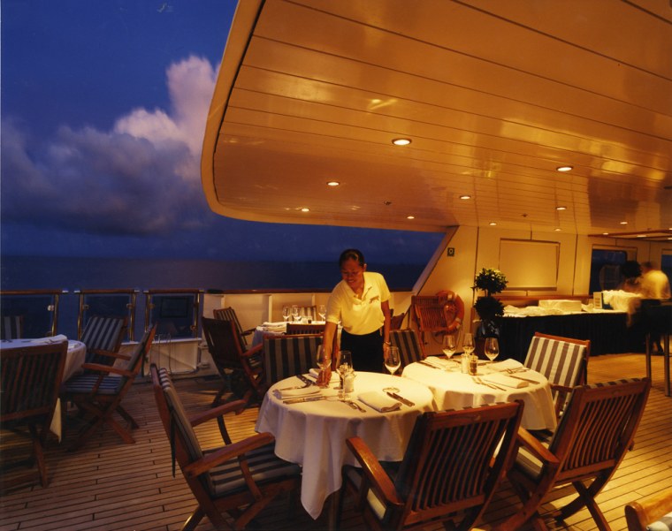 Image: Dinner is served:  The Orion's Delphinius Cafe presents a locally inspired menu under the stars.