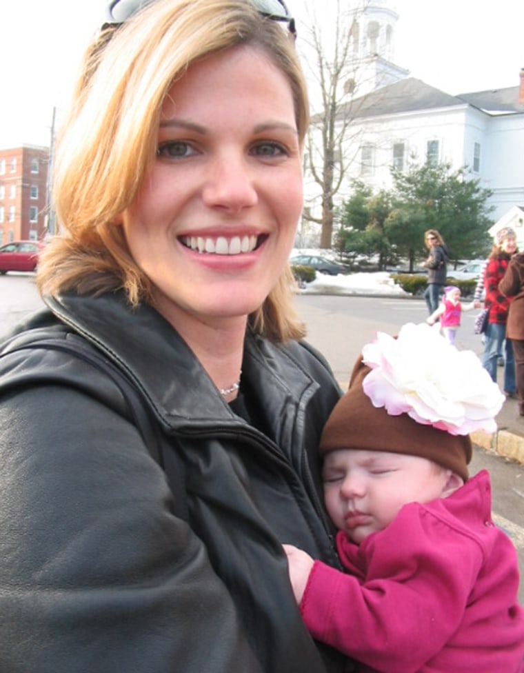 Susan Shanelaris, with her two-month old daughter at the Exeter, N.H. town hall, voted for Mitt Romney Tuesday morning.