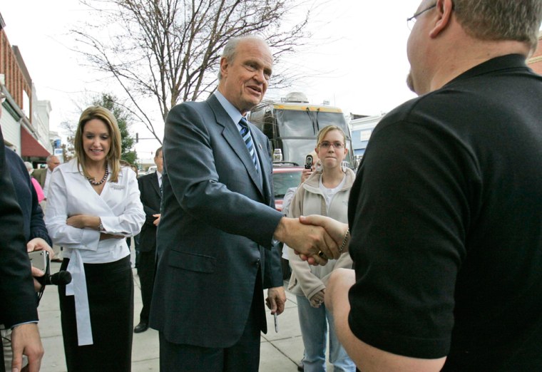 Image: Republican presidential hopeful former Sen. Fred Thompson, R-Tenn., center, and his wife Jeri, left, stop to meet people on Main Street Tuesday, Jan. 8, 2008 in Camden, S.C.