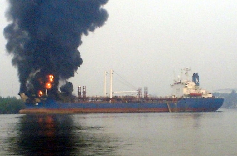 Image: A plume of smoke rises from an oil tanker after an explosion in Port Harcourt