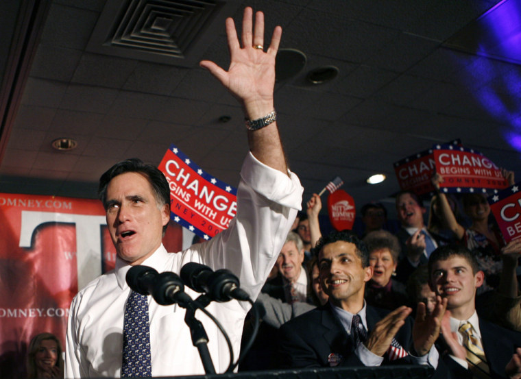 Image: US Republican presidential candidate and former Massachusetts Governor Mitt Romney waves to his supporters at his Michigan primary night rally in Southfield, Michigan