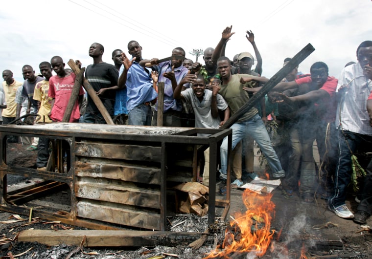 Opposition party supporters react to the camera as they protest in Kisumu, western Kenya, on Wednesday. 