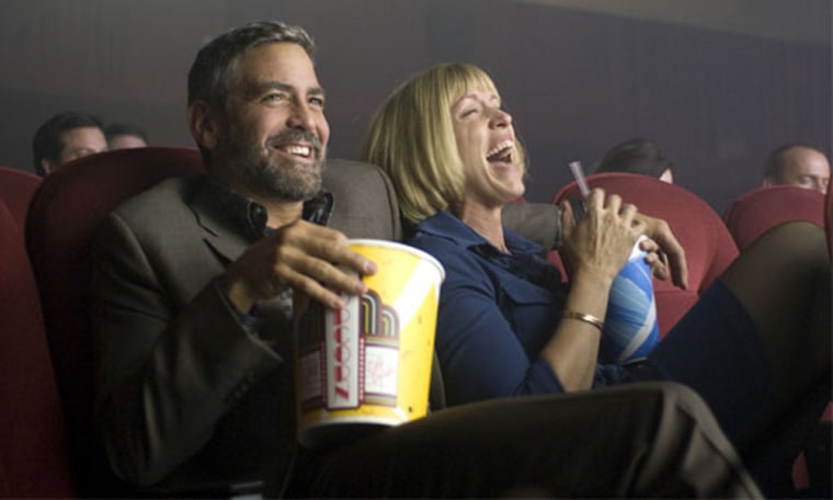 The first picture from the upcoming Coen Brothers' comedy/drama \"Burn After Reading,\" starring George Clooney and Brad Pitt, has been released. It features Clooney enjoying his popcorn at the theaters.