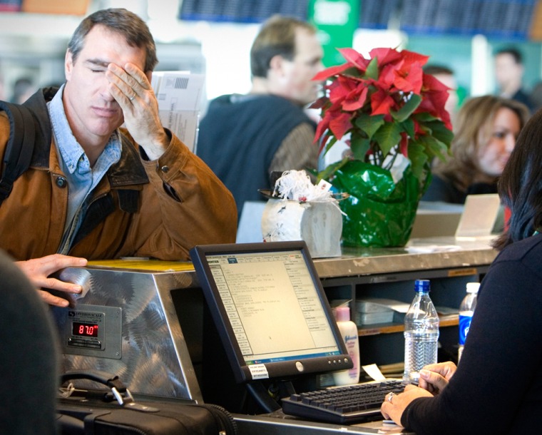 Image: Airline passenger at a ticket counter