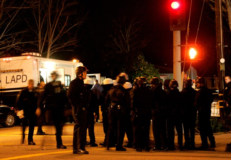 Image: Los Angeles police officers congregate at a standoff.