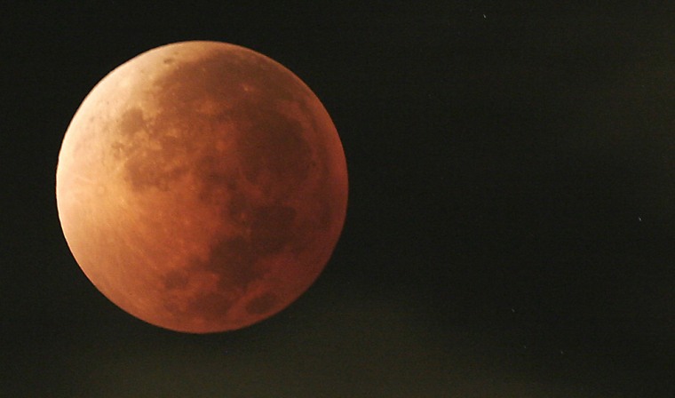 Image:  a lunar eclipse over Mexico City