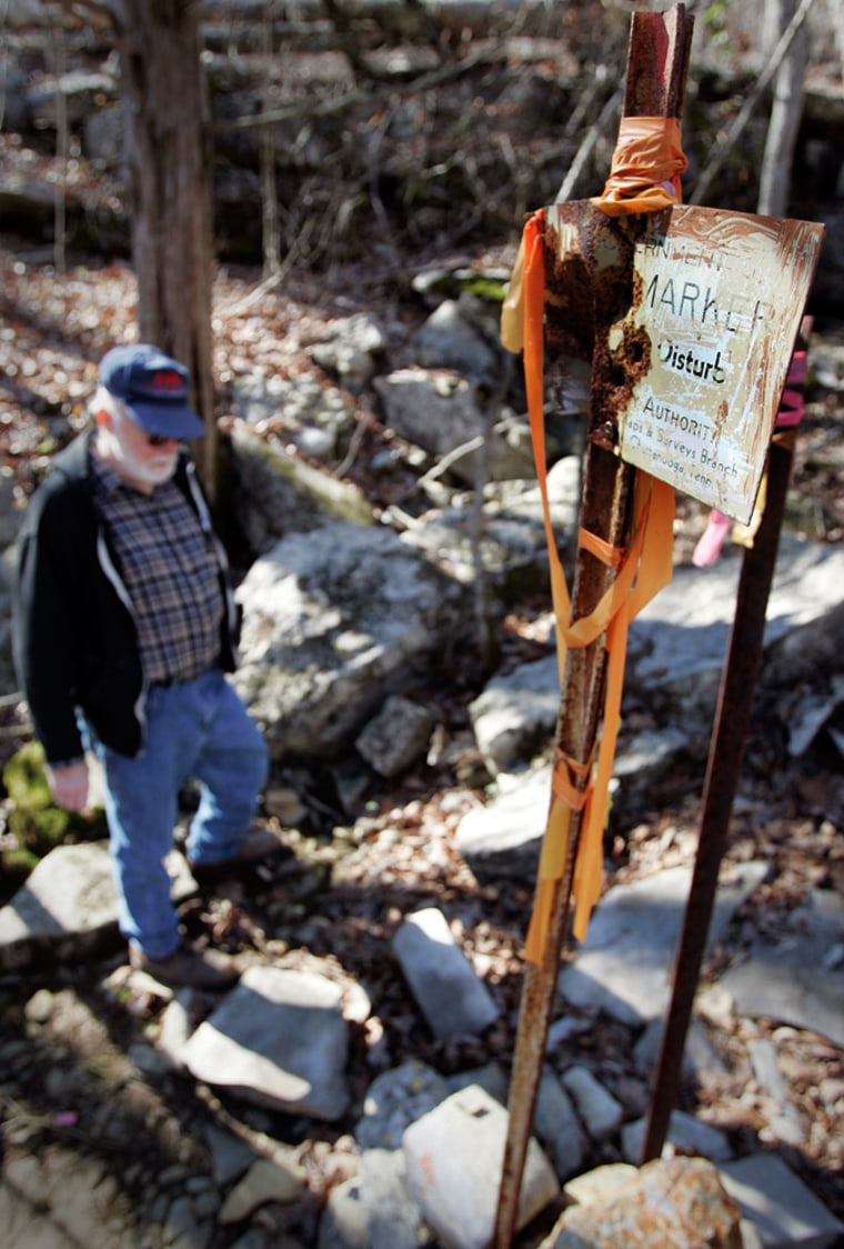Image: Georgia resident Jerry Body walks past a marker in Cole City Hollow Tenn.