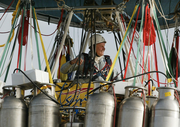 Image: Steve Fossett does some pre flight checking aboard