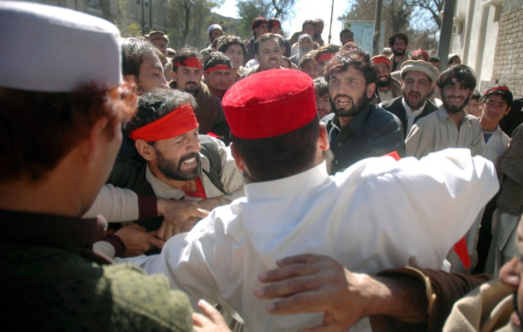 Image: Supporters of a losing political candidate scuffle