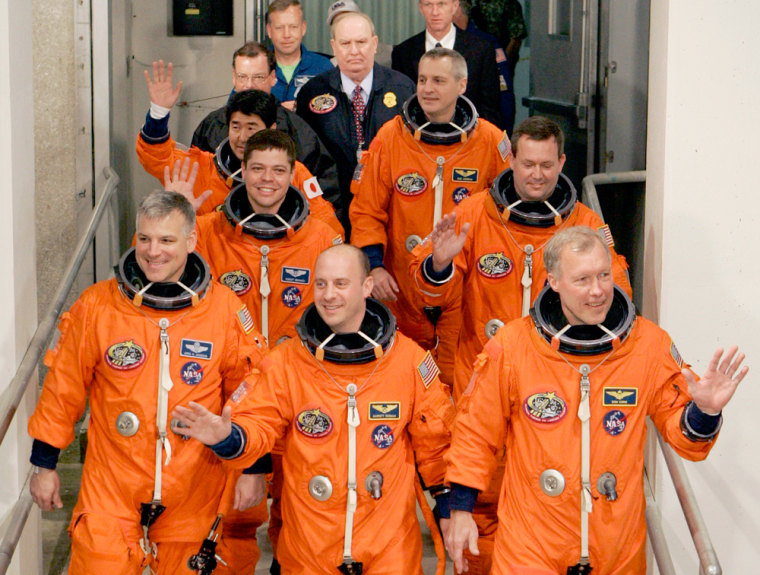 Image: Astronauts head for shuttle