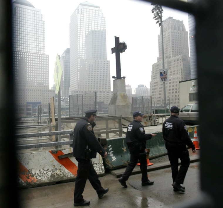 Image: Port Authority police patrol ground zero at the World Trade Center site in New York