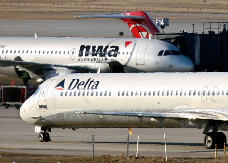 Image: Delta Airlines and Northwest Airlines jets at the Minneapolis St.Paul International Airport in Minnesota