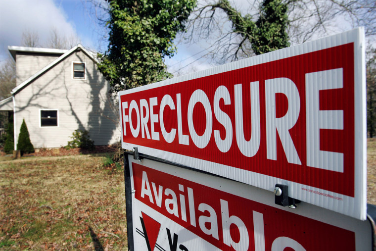 Image: Foreclosure sign in front of house