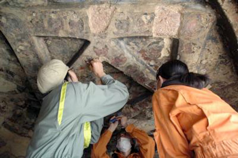 Image: Researchers take samples from caves