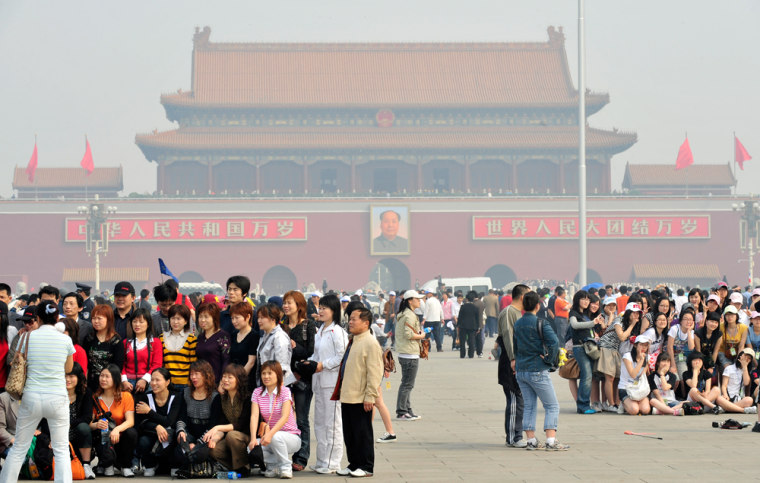 Image: Tourists visit Tiananmen Square