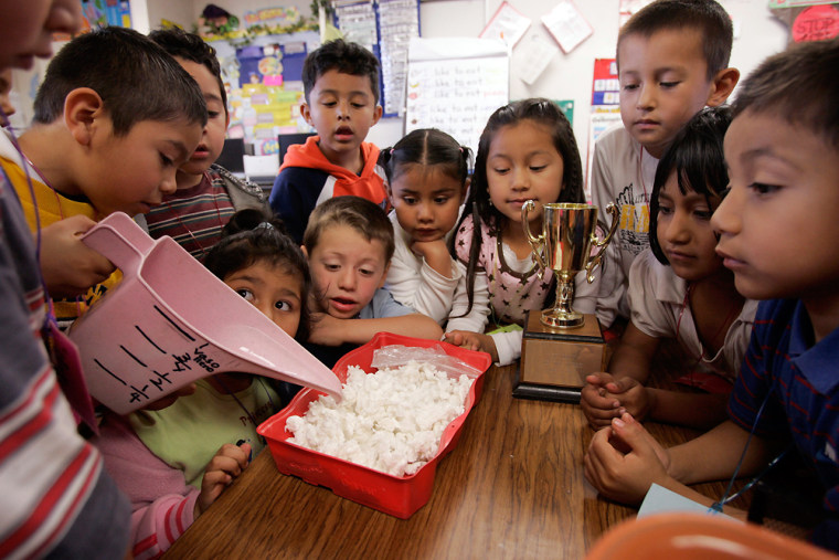 Image: First-grade students perform an experiment at Las Palmitas Elementary School